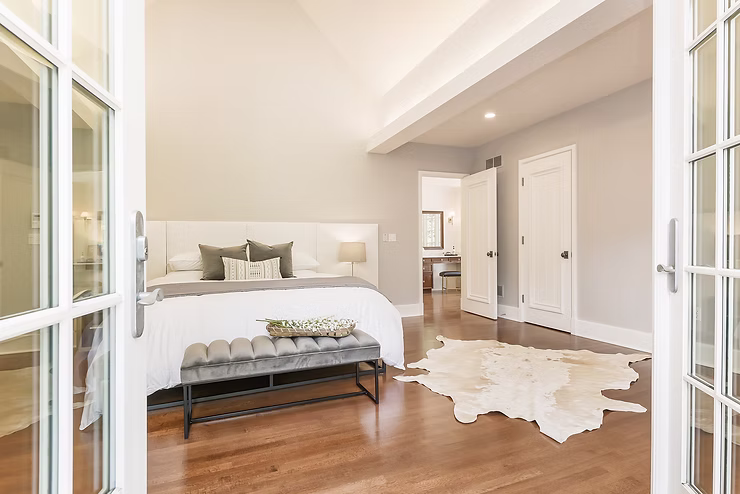 Interior designer reviewing home plans with client, discussing design choices and project goals